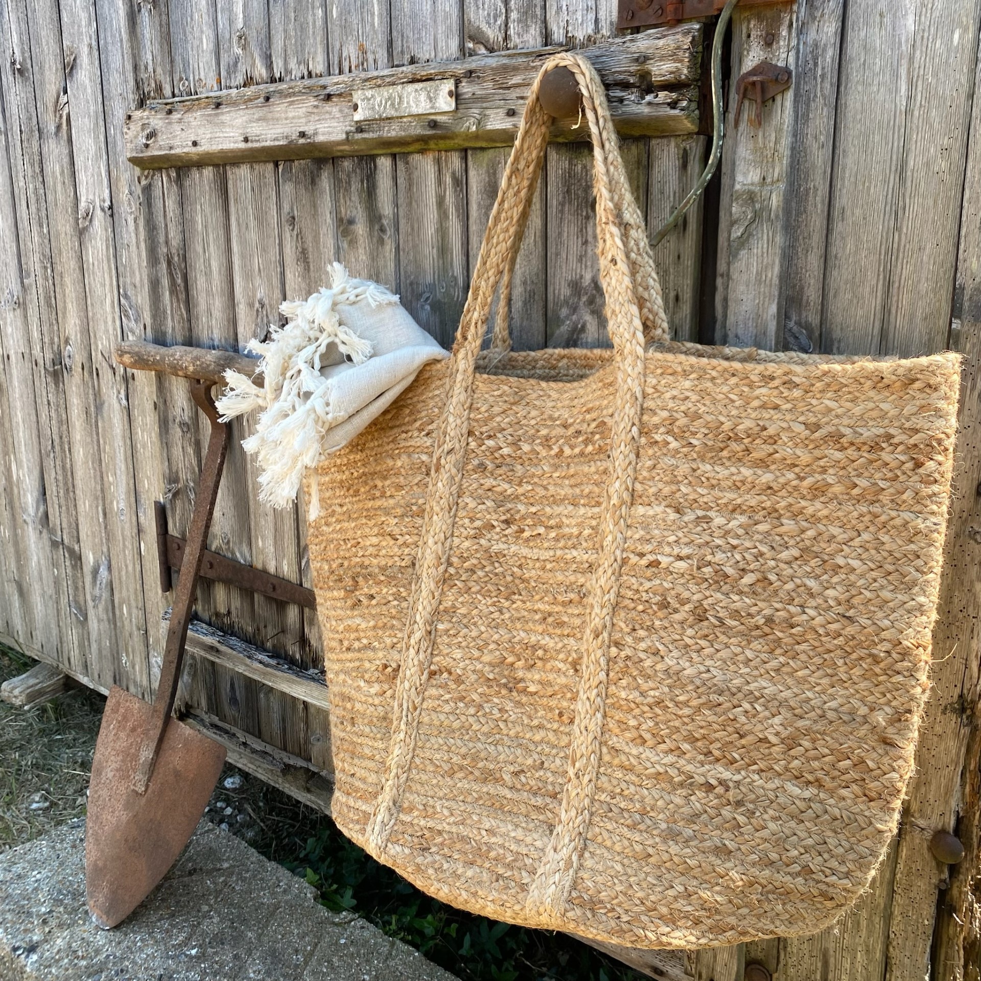 Large natural jute storage bag with handles